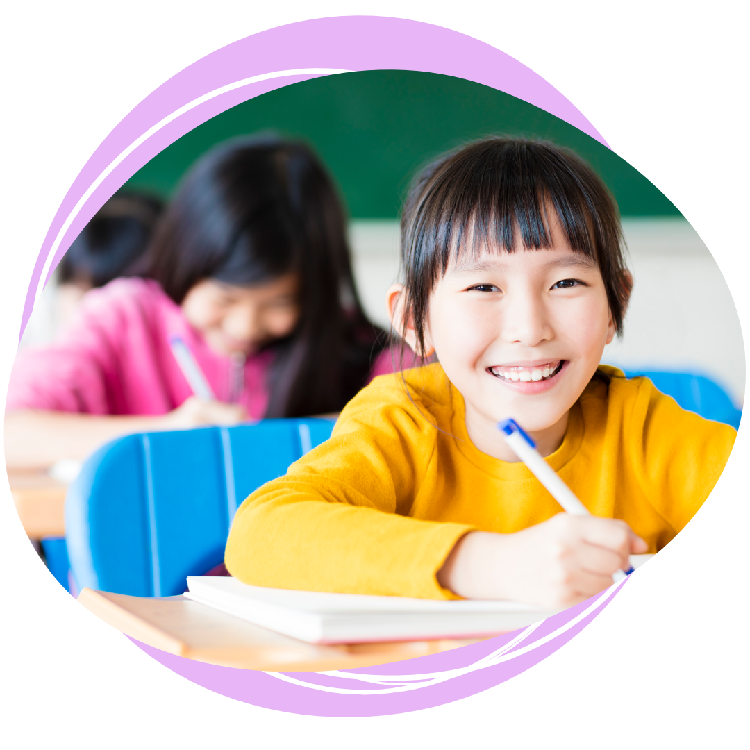 Student writing at her desk