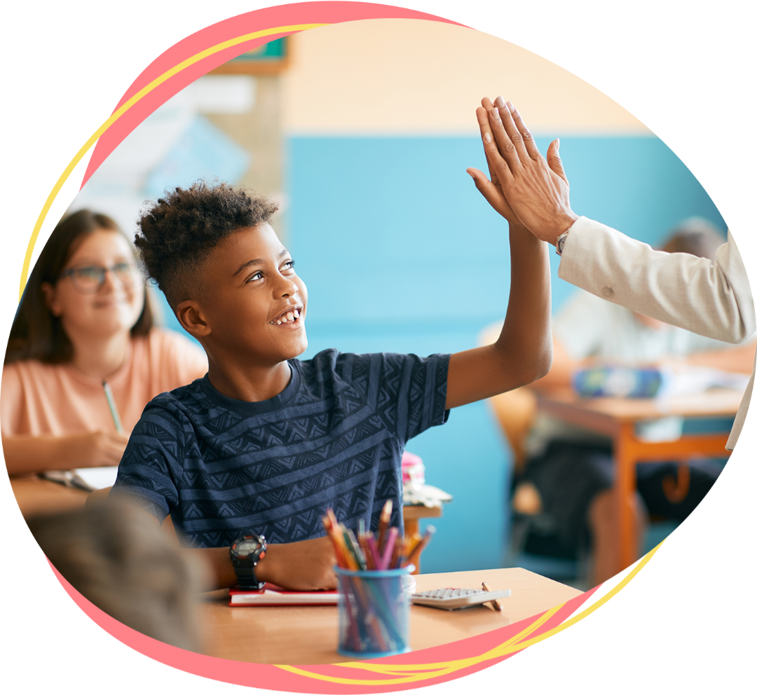 Student in class, hi-five